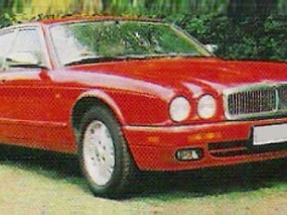 Jaguar's X300 - doesn't look so bad in odd colours as you'd think.